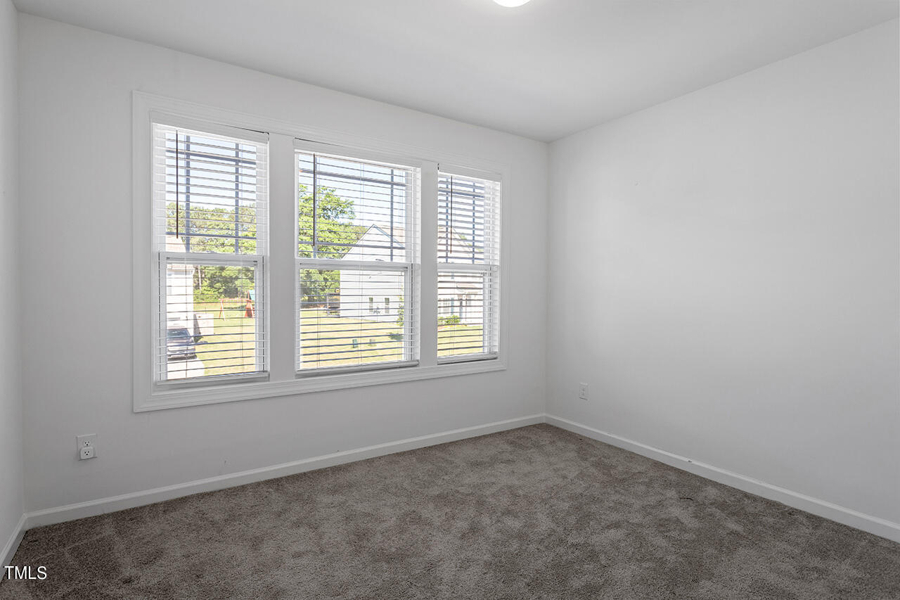 147 Pineapple Place Benson, NC 27504 - Photo 16 of 20 an empty room with a window