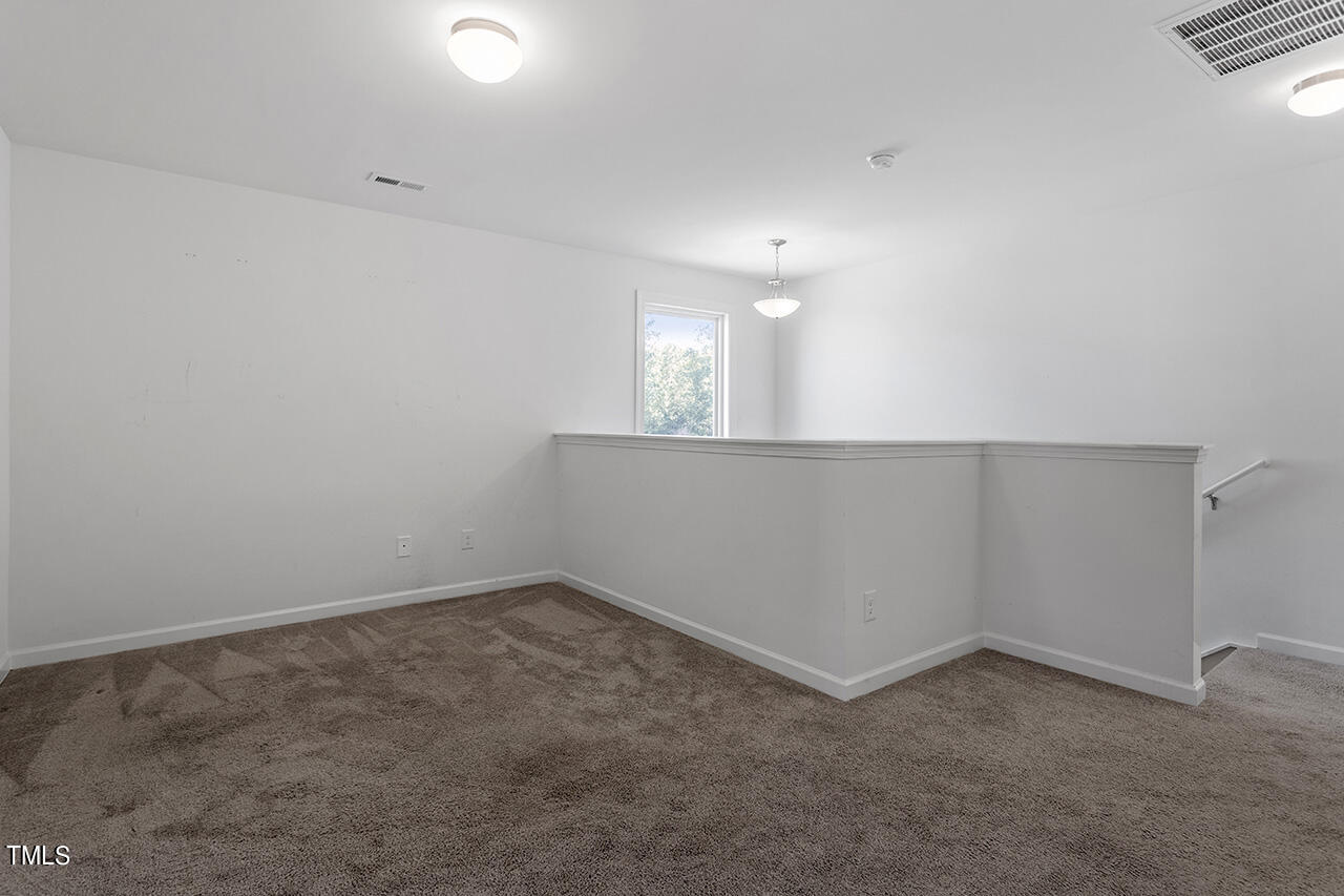 147 Pineapple Place Benson, NC 27504 - Photo 17 of 20 an empty room with a empty space