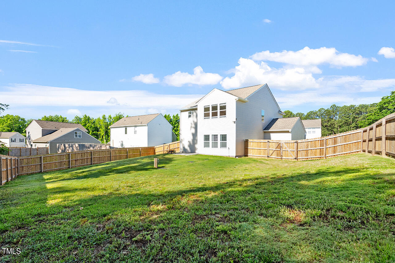 147 Pineapple Place Benson, NC 27504 - Photo 19 of 20 a view of a house with a yard and sitting area