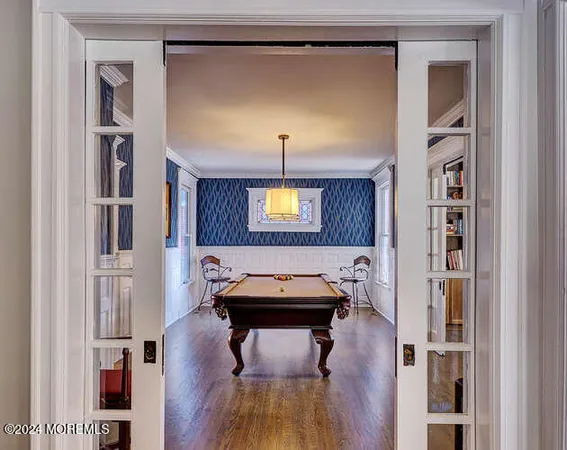 a kitchen with stainless steel appliances granite countertop a stove top oven a sink and a refrigerator