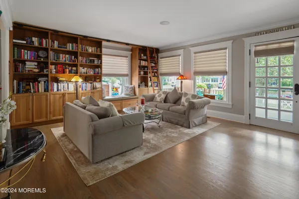 a living room with furniture fireplace and a flat screen tv