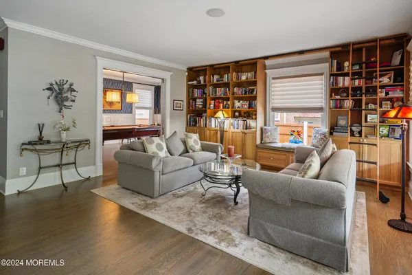 a view of a dining room with furniture and wooden floor