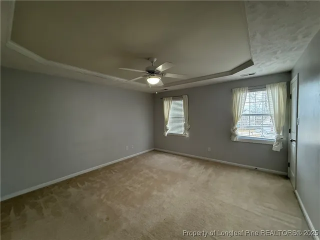 a big house with a big yard and potted plants