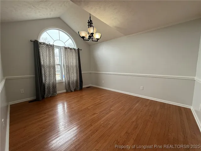 a kitchen with stainless steel appliances granite countertop a sink and a stove