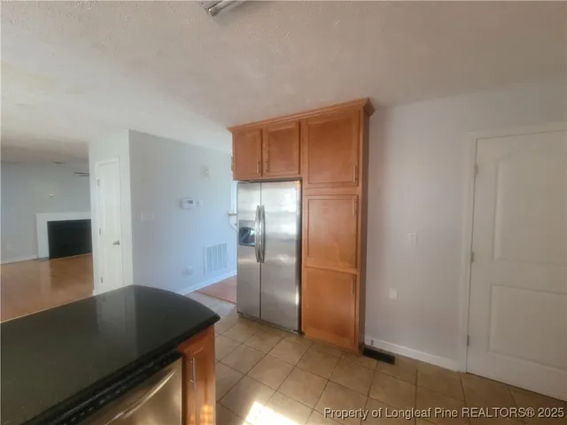 a bathroom with a bath tub with a shower