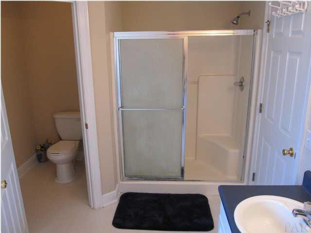 3077 Red Fern Road Cantonment, FL 32533 - Photo 16 of 25 Master bath has private commode closet & separate shower with 2 seats.