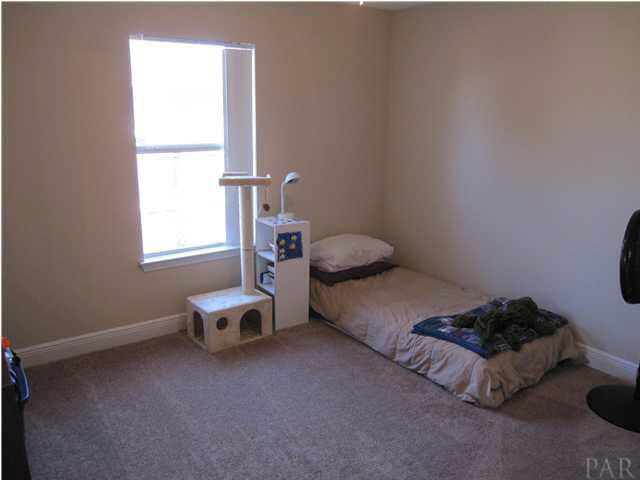 3077 Red Fern Road Cantonment, FL 32533 - Photo 20 of 25 Additional bedroom #3 with lighted ceiling fan. Walk-in closet to your right.