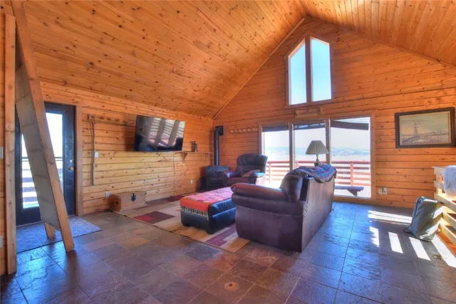 a view of a kitchen with a table and chairs