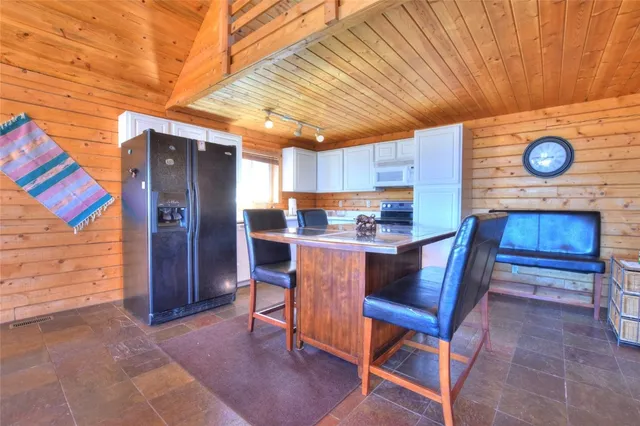 a bathroom with a toilet and a shower curtain