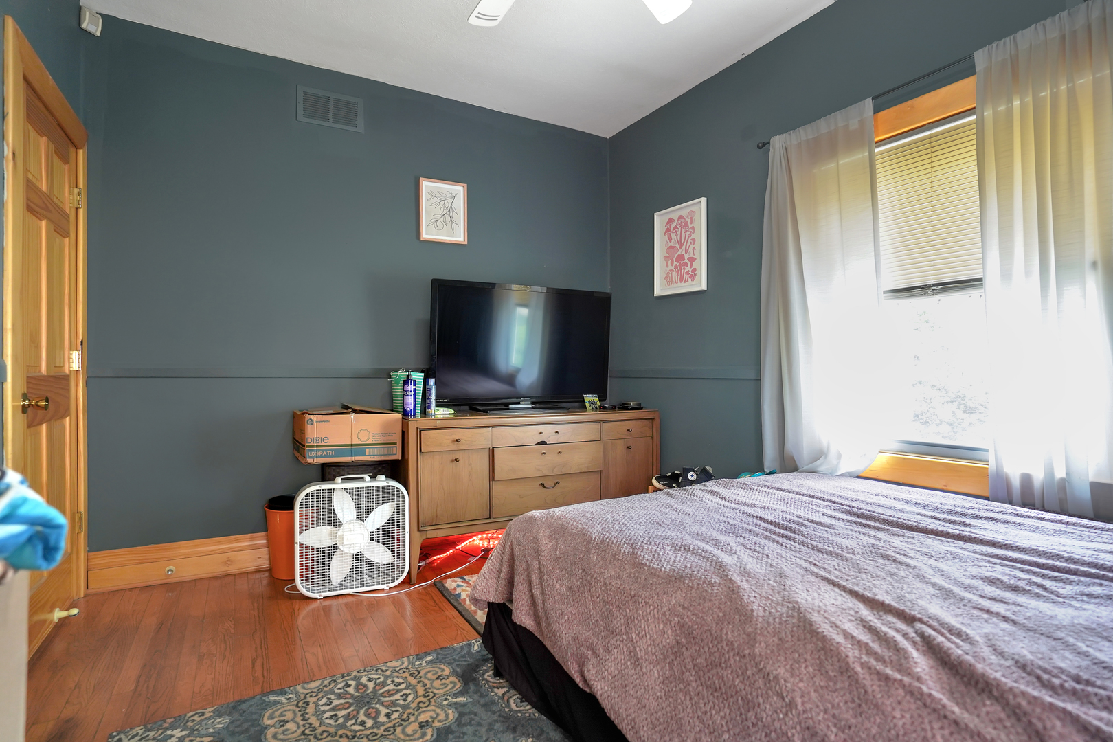 1134 South Myrtle Avenue Kankakee, IL 60901 - Photo 17 of 32 a bedroom with a bed and a flat screen tv