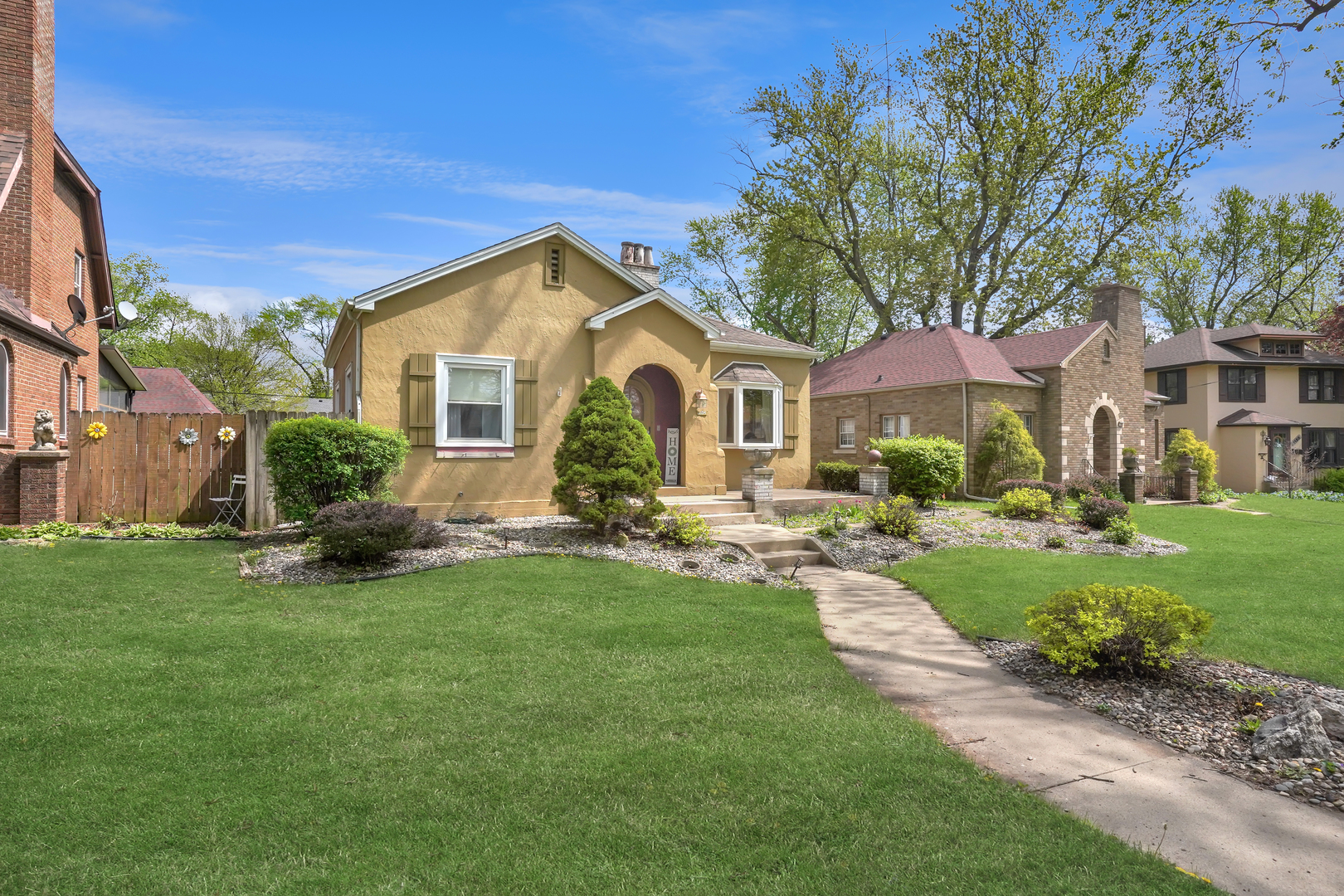 1134 South Myrtle Avenue Kankakee, IL 60901 - Photo 2 of 32 a view of a house with a big yard potted plants and large tree