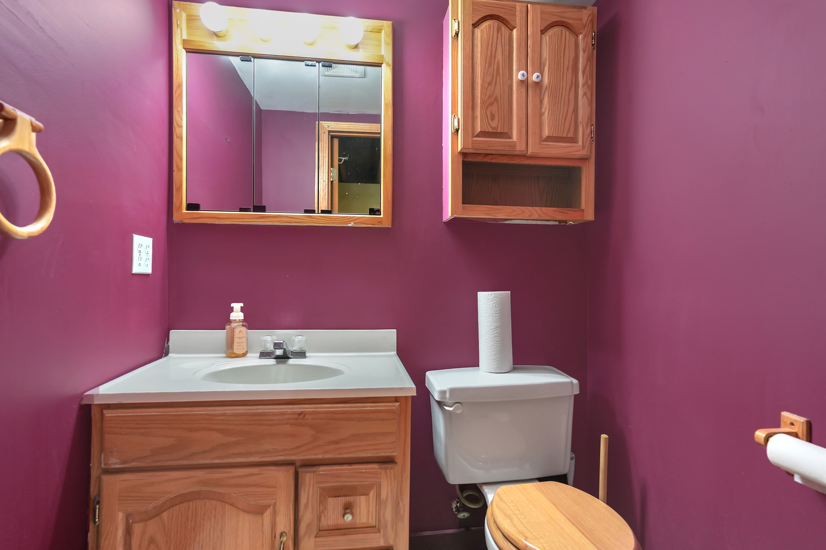 1134 South Myrtle Avenue Kankakee, IL 60901 - Photo 26 of 32 a bathroom with a toilet a sink and mirror