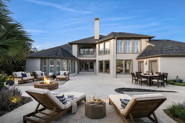 a front view of a house with sitting area