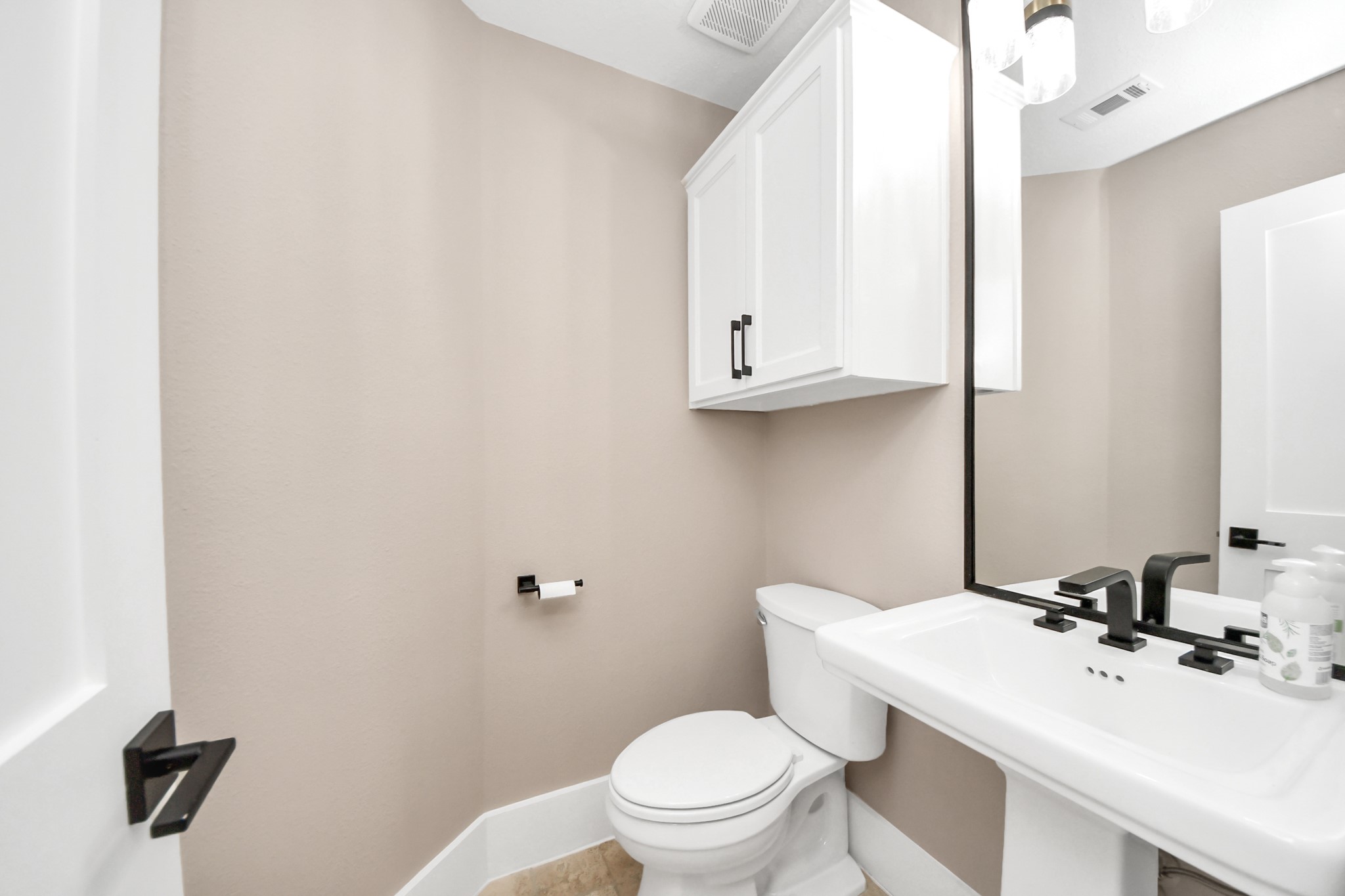 2211 Braer Ridge Drive Katy, TX 77494 - Photo 21 of 50 a bathroom with a sink a toilet and mirror