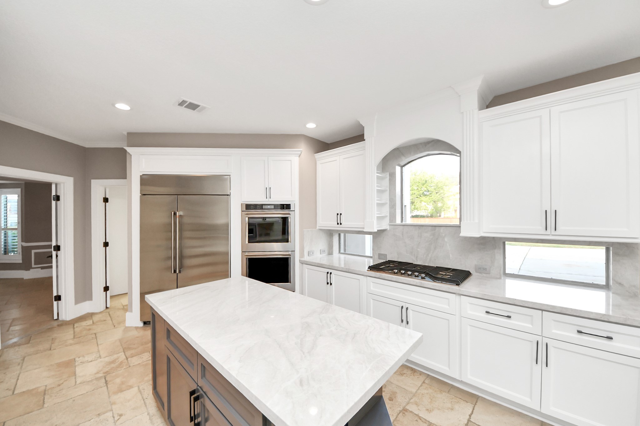 2211 Braer Ridge Drive Katy, TX 77494 - Photo 31 of 50 a kitchen with granite countertop a stove a sink and a refrigerator