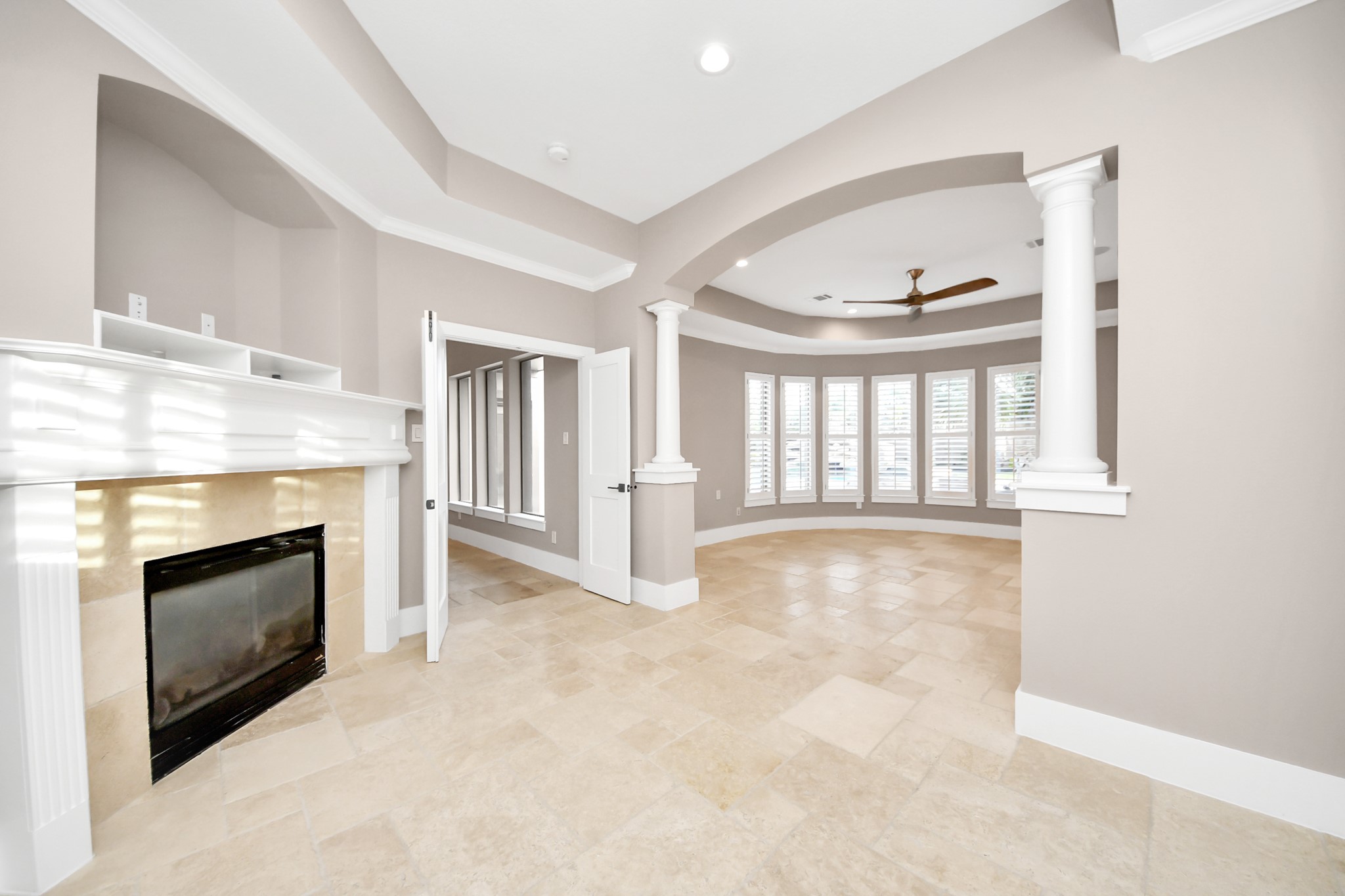 2211 Braer Ridge Drive Katy, TX 77494 - Photo 34 of 50 an empty room with fireplace and windows