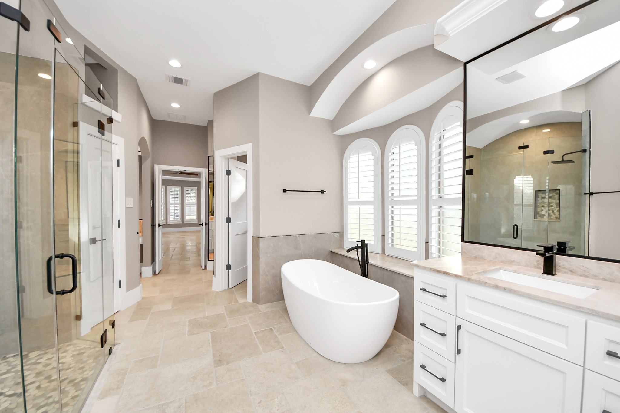 2211 Braer Ridge Drive Katy, TX 77494 - Photo 40 of 50 a spacious bathroom with a double vanity sink mirror and bathtub