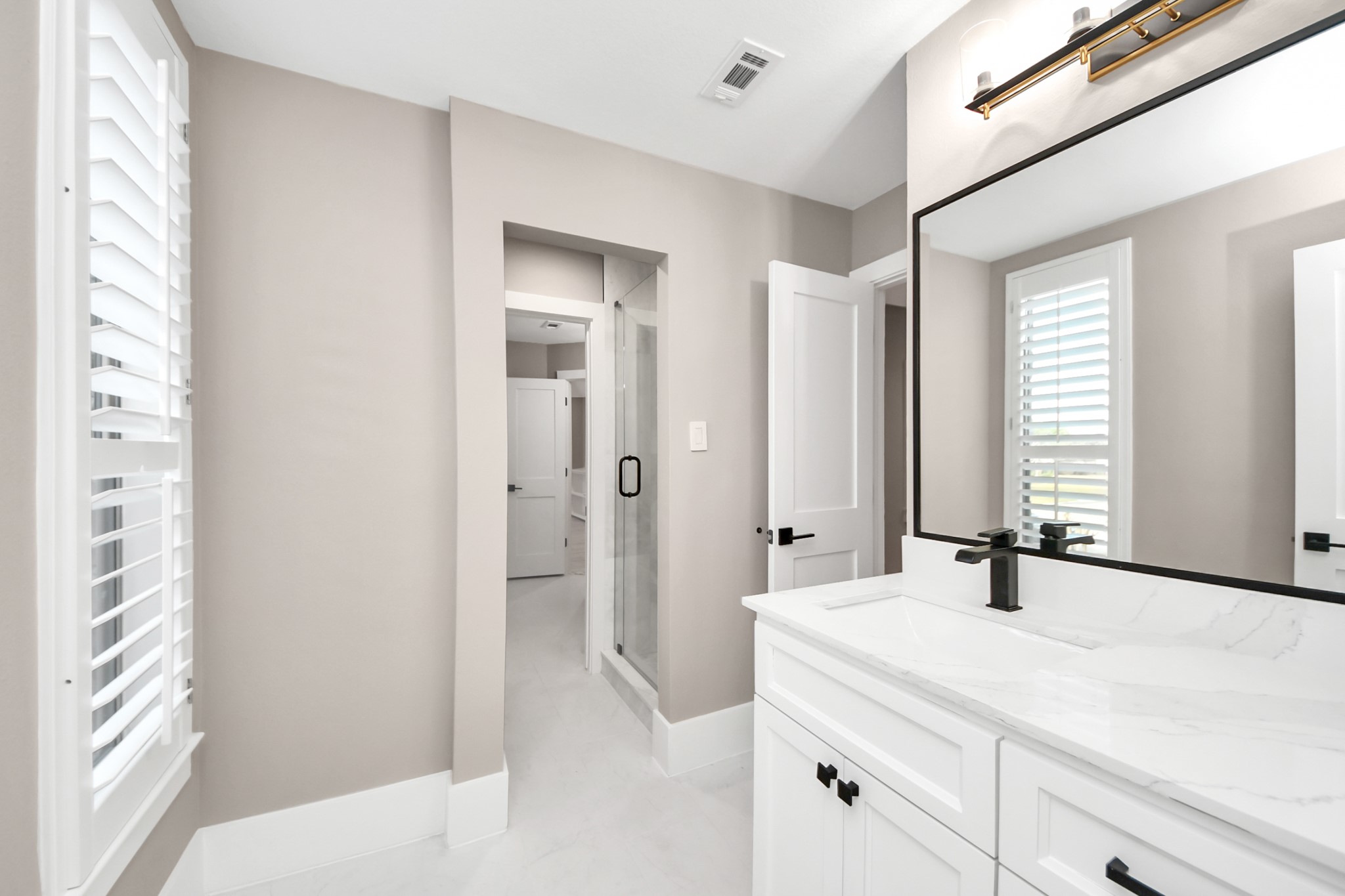 2211 Braer Ridge Drive Katy, TX 77494 - Photo 49 of 50 a bathroom with a double vanity sink and mirror