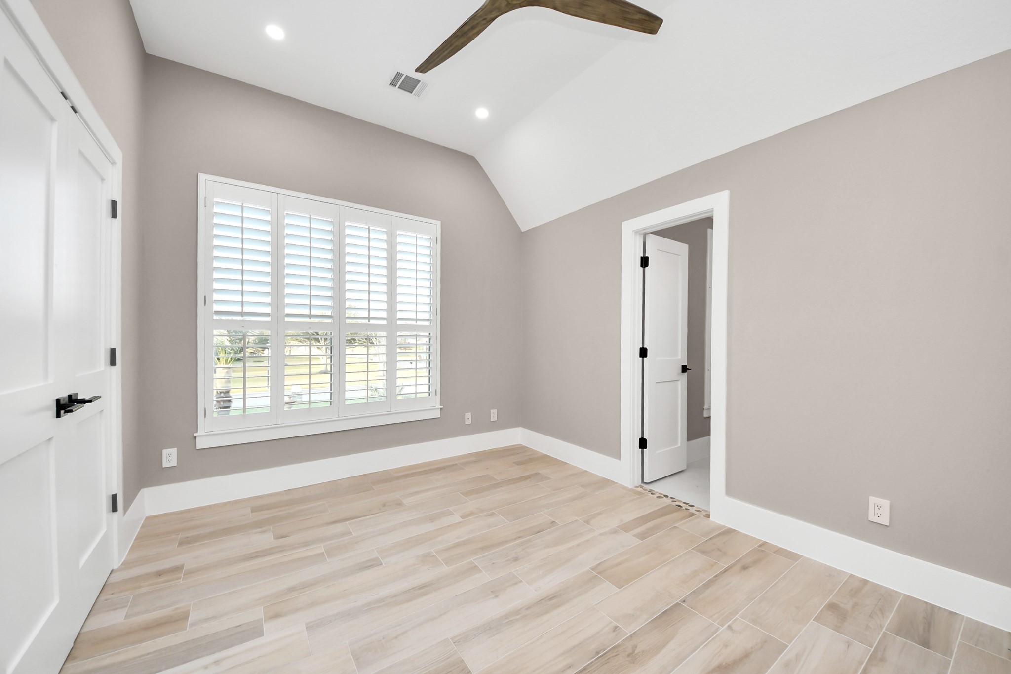 2211 Braer Ridge Drive Katy, TX 77494 - Photo 50 of 50 a view of an empty room with wooden floor and a window