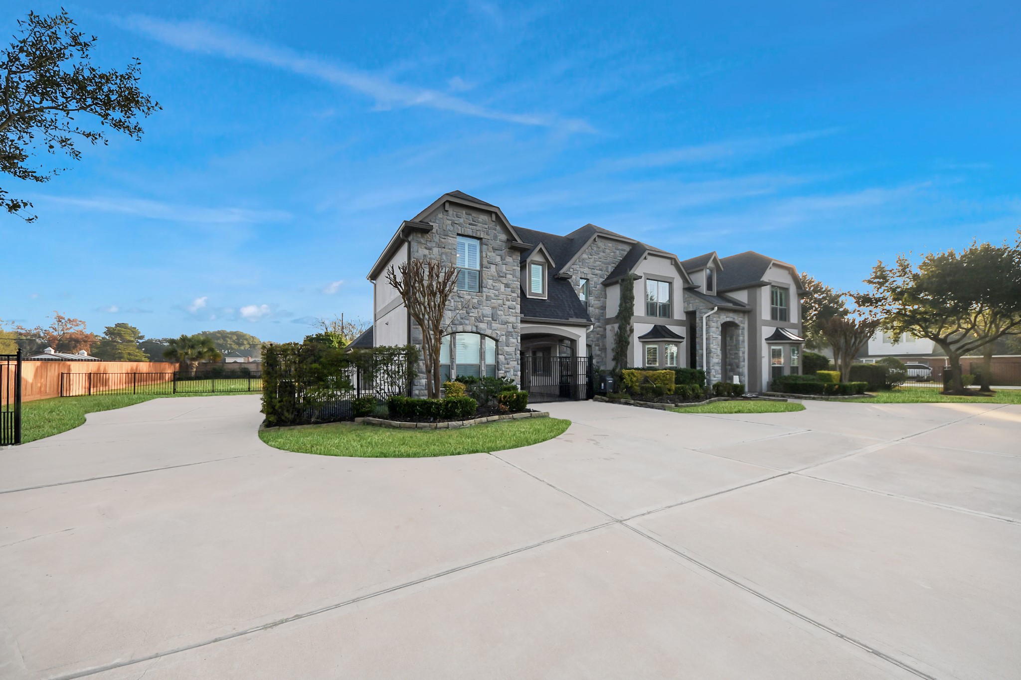 2211 Braer Ridge Drive Katy, TX 77494 - Photo 6 of 50 a view of a big building with a big yard and large trees