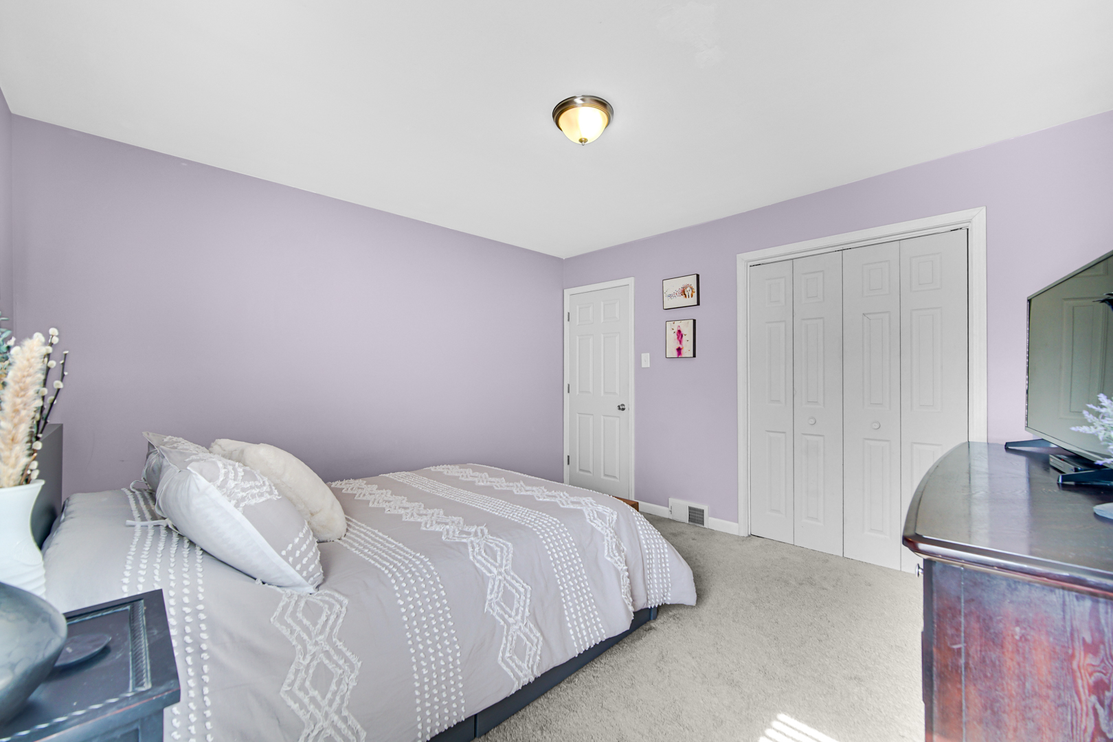 1634 Burr Oak Road Homewood, IL 60430 - Photo 13 of 36 a bedroom with a bed and a flat screen tv