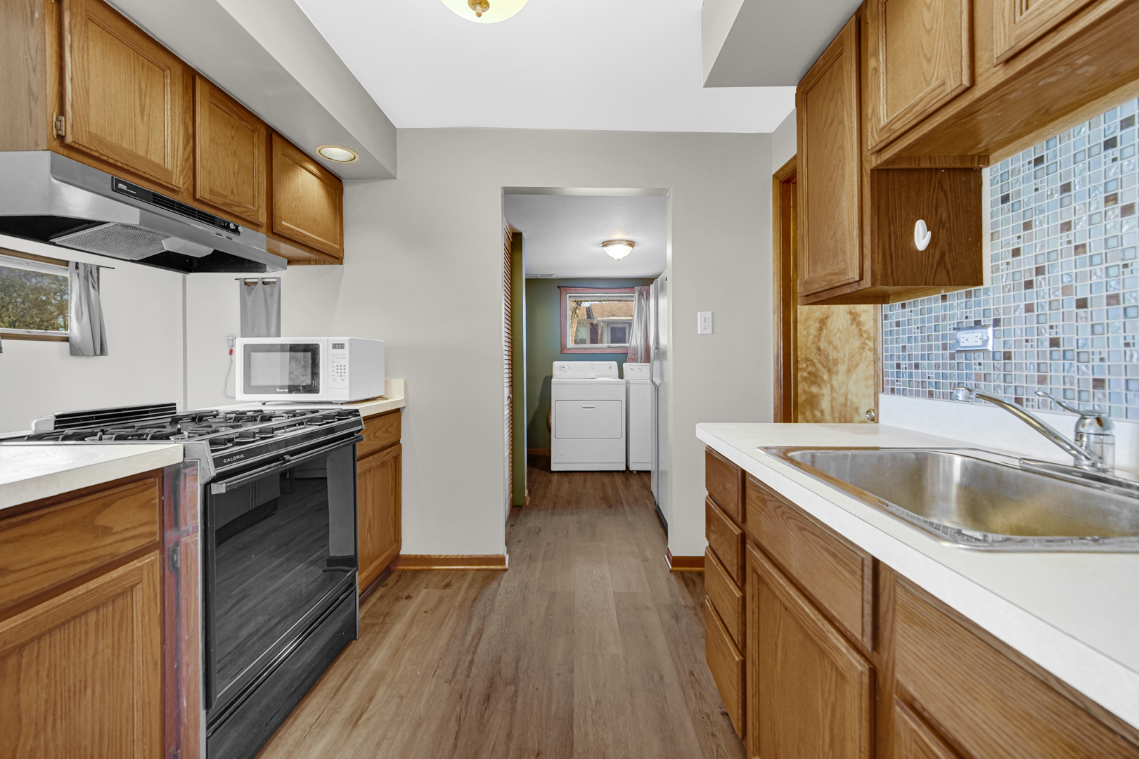 1634 Burr Oak Road Homewood, IL 60430 - Photo 18 of 36 a kitchen with a sink and a stove top oven