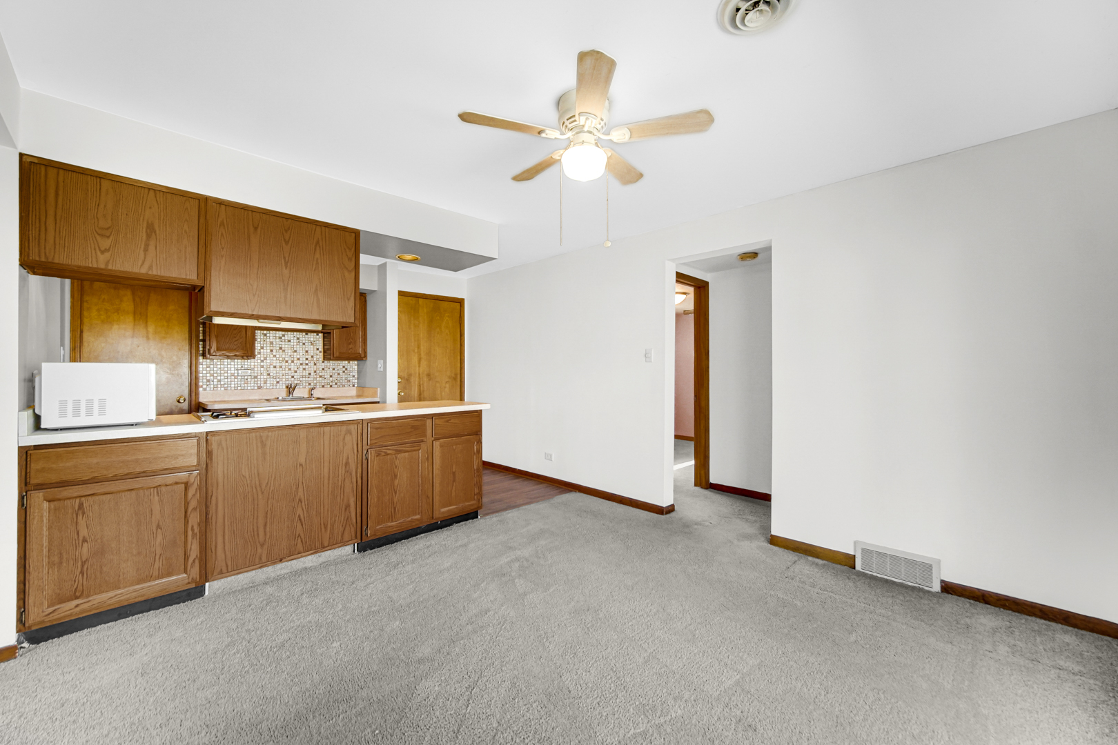 1634 Burr Oak Road Homewood, IL 60430 - Photo 19 of 36 a kitchen with a cabinets and chandelier