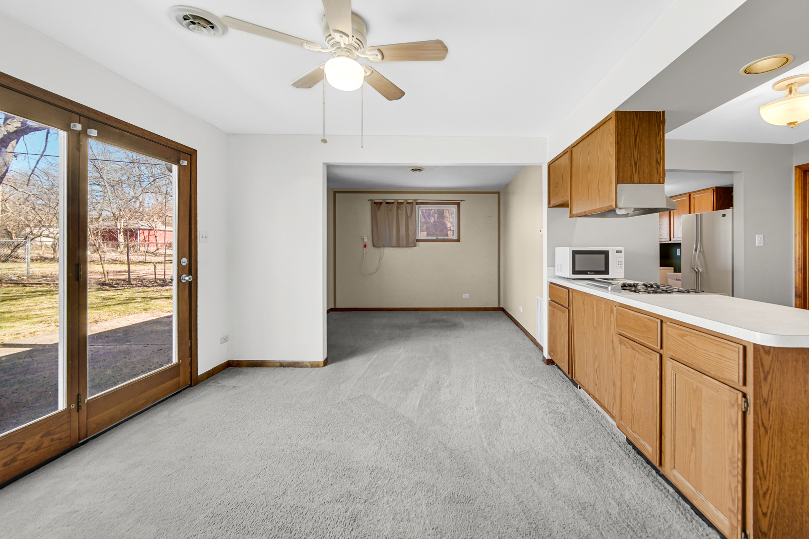 1634 Burr Oak Road Homewood, IL 60430 - Photo 20 of 36 a large kitchen with stainless steel appliances a large window a oven a counter space and a window
