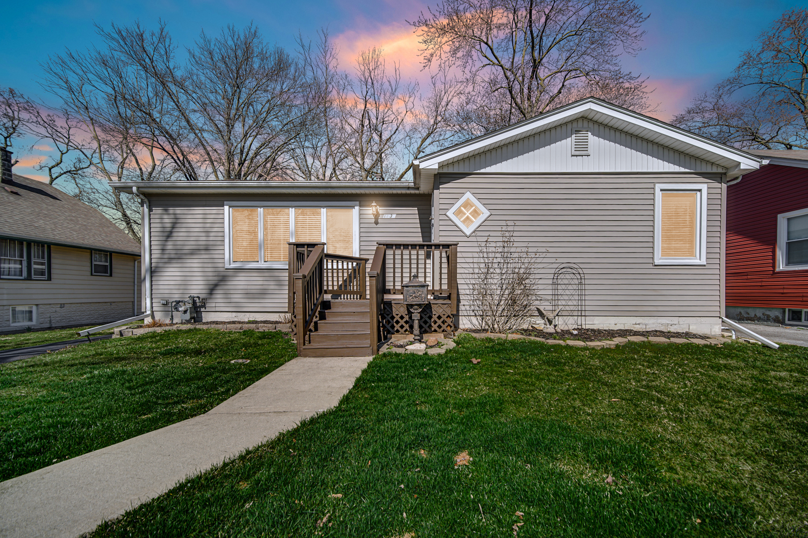 1634 Burr Oak Road Homewood, IL 60430 - Photo 2 of 36 a front view of a house with a garden and yard
