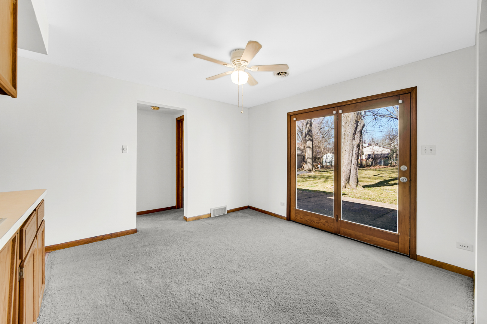 1634 Burr Oak Road Homewood, IL 60430 - Photo 21 of 36 an empty room with chandelier fan and windows