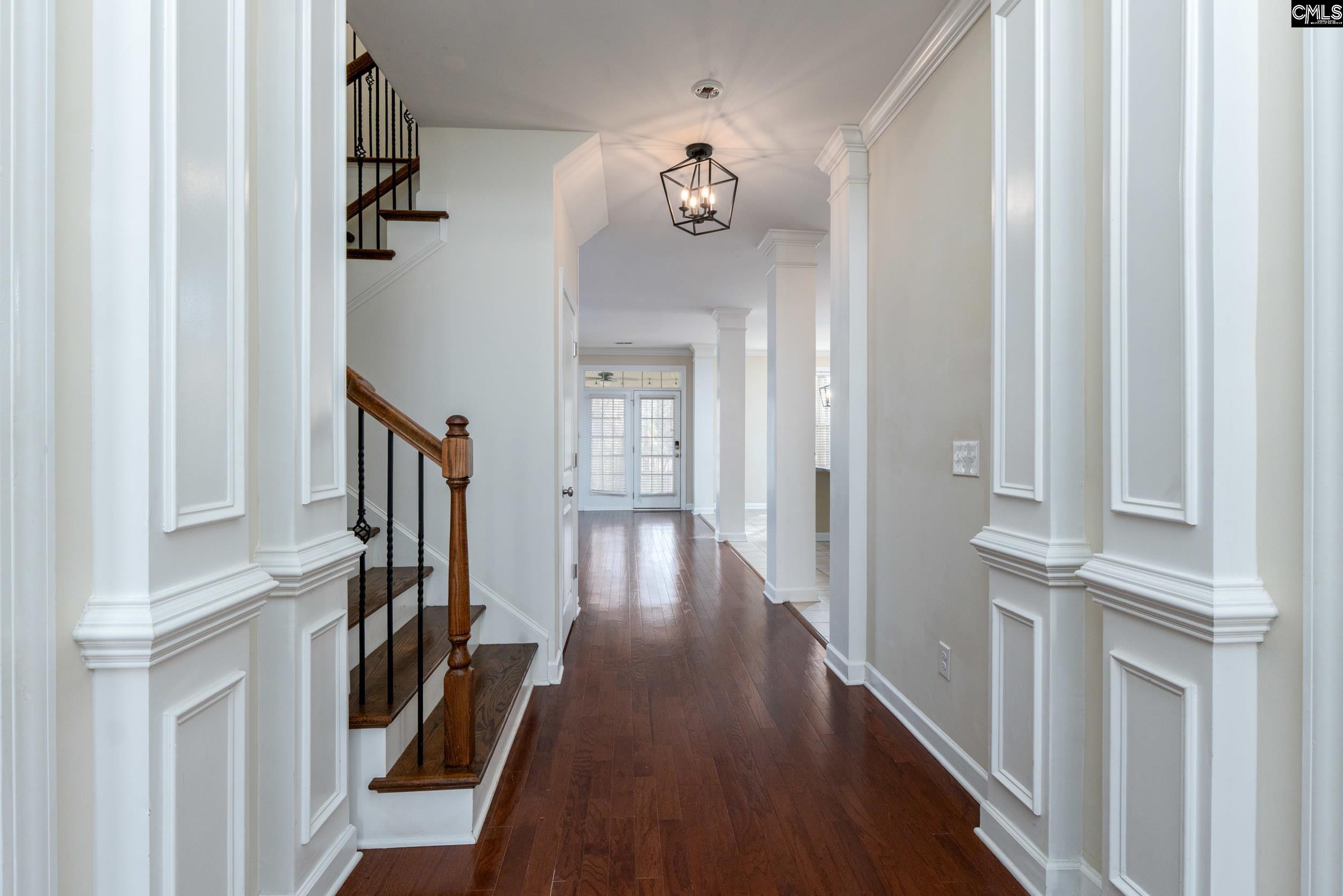 40 Wading Bird Loop Blythewood, SC 29016 - Photo 2 of 26 a view of a hallway with wooden floor and staircase