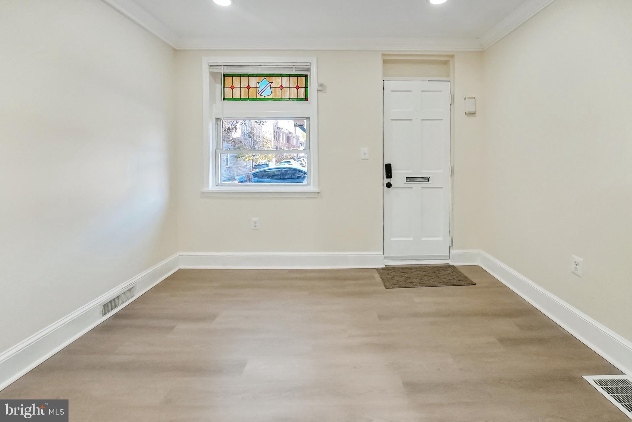 2725 Hudson Street Baltimore, MD 21224 - Photo 20 of 66 an empty room with windows and closet