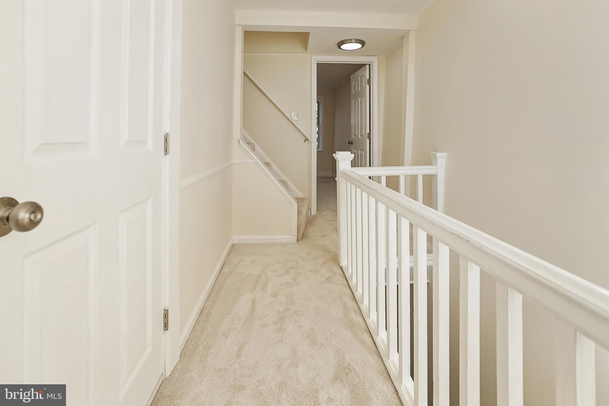 2725 Hudson Street Baltimore, MD 21224 - Photo 36 of 66 a view of a hallway with wooden floor and entryway