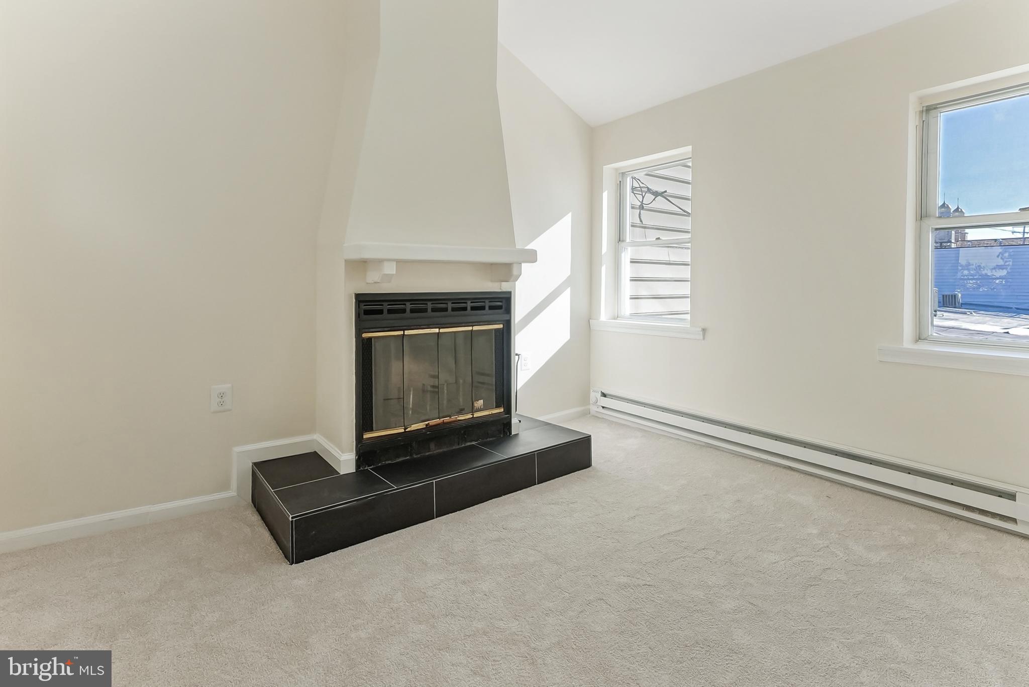 2725 Hudson Street Baltimore, MD 21224 - Photo 48 of 66 a living room with a fireplace