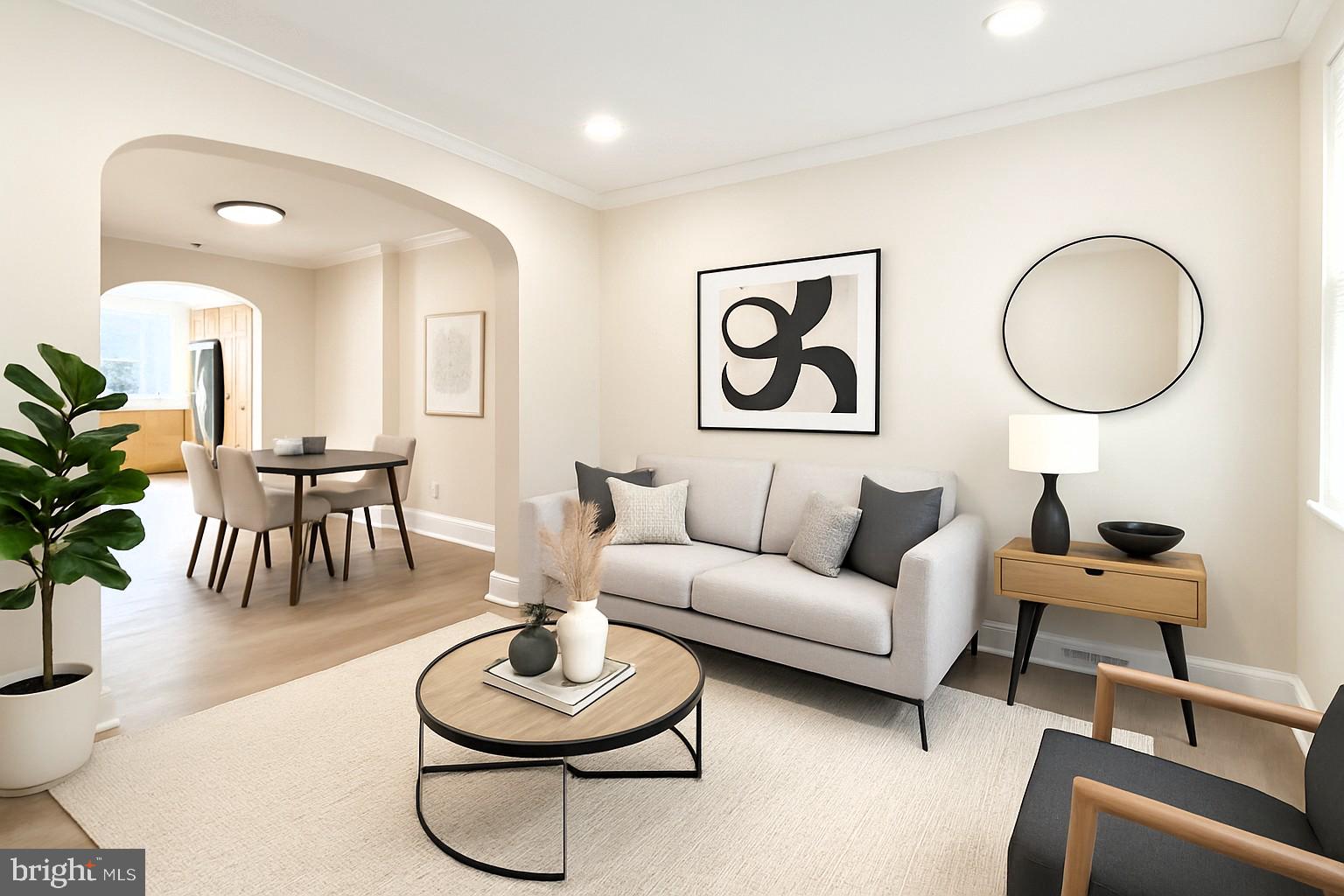 2725 Hudson Street Baltimore, MD 21224 - Photo 7 of 66 a living room with furniture a rug and a potted plant