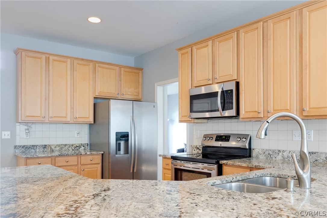 1101 Goswick Ridge Road Midlothian, VA 23114 - Photo 15 of 34 a kitchen with stainless steel appliances granite countertop a refrigerator stove microwave and sink
