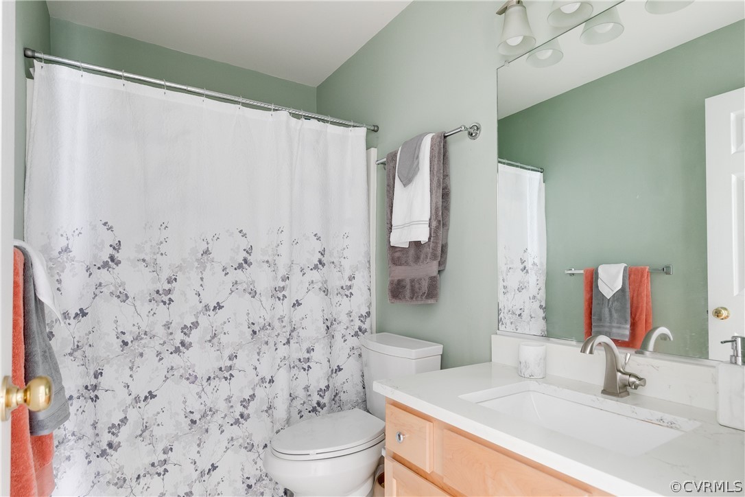 1101 Goswick Ridge Road Midlothian, VA 23114 - Photo 20 of 34 a bathroom with a sink toilet and shower