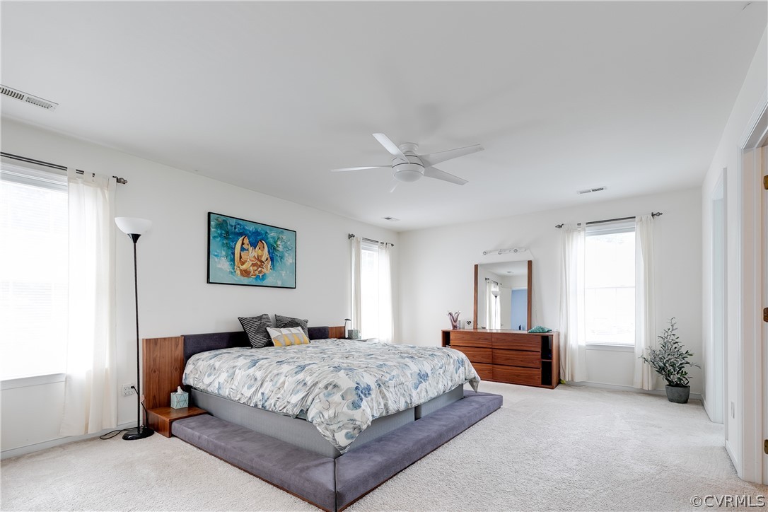 1101 Goswick Ridge Road Midlothian, VA 23114 - Photo 25 of 34 a bedroom with a bed and a chandelier