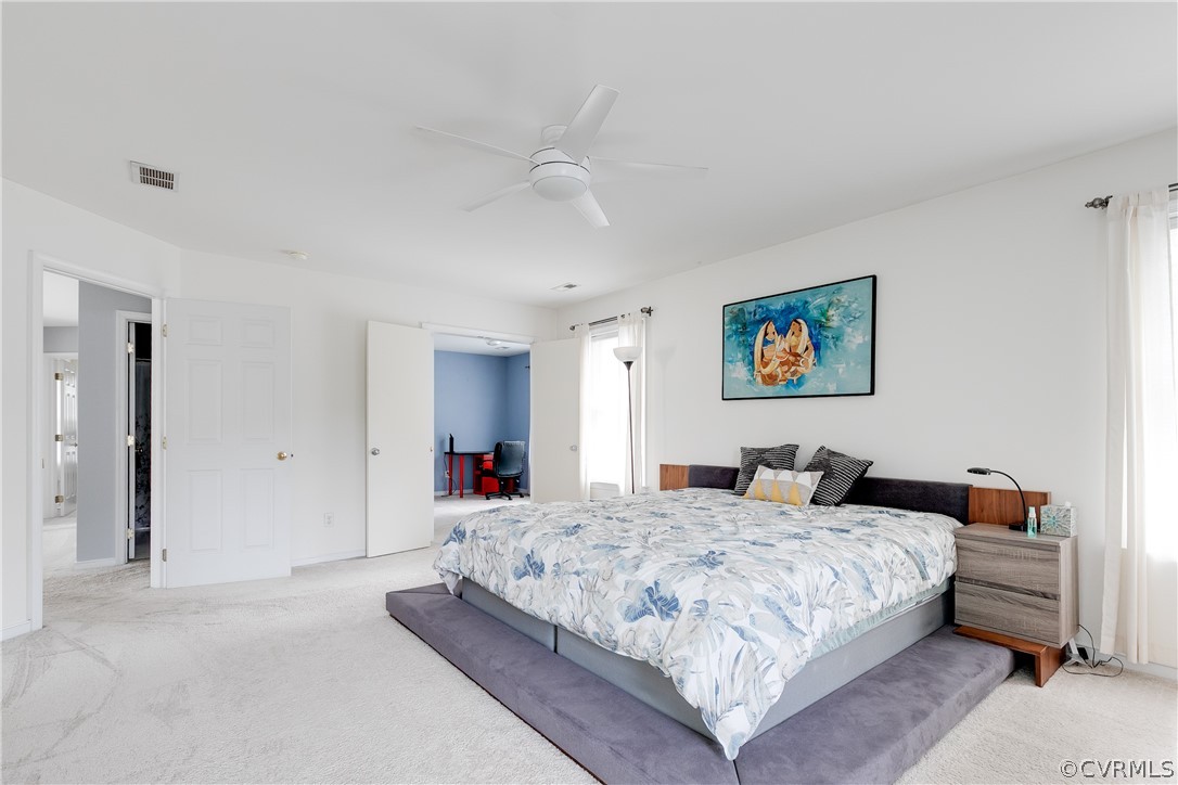 1101 Goswick Ridge Road Midlothian, VA 23114 - Photo 26 of 34 a bedroom with a bed and a chandelier