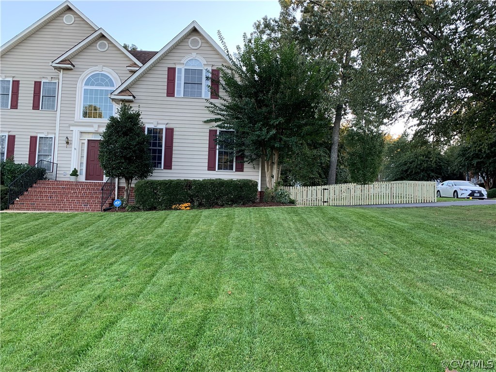 1101 Goswick Ridge Road Midlothian, VA 23114 - Photo 33 of 34 a front view of house with yard and green space