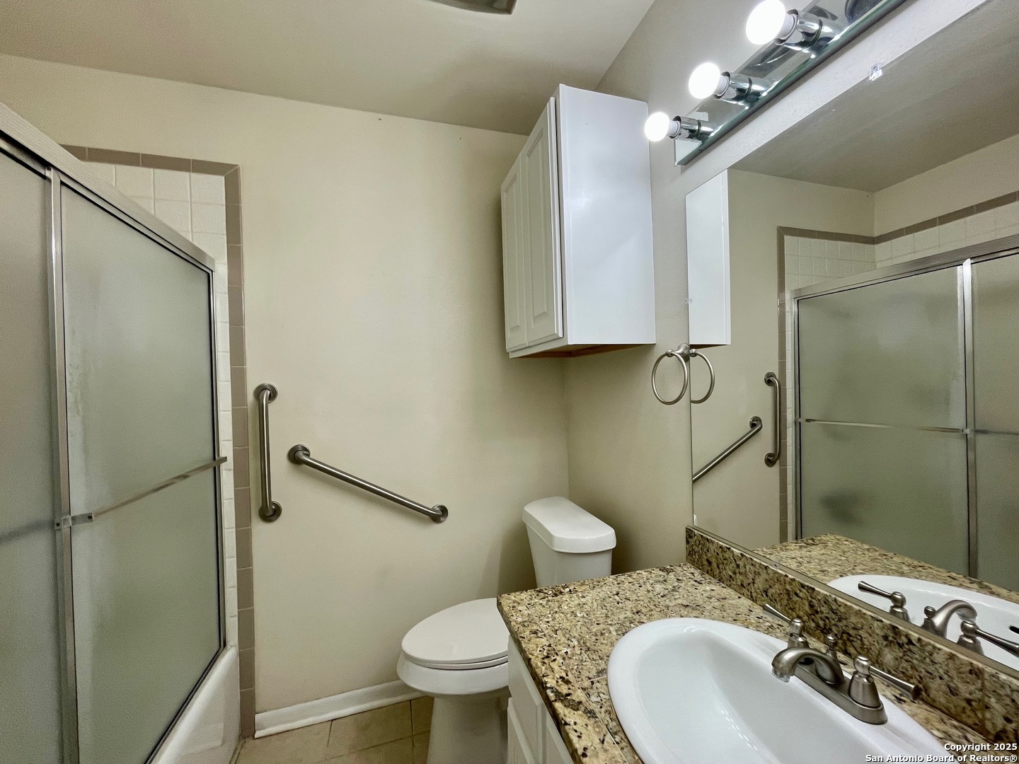 6714 Straw Flower Street Leon Valley, TX 78238 - Photo 17 of 23 a bathroom with a sink toilet and shower