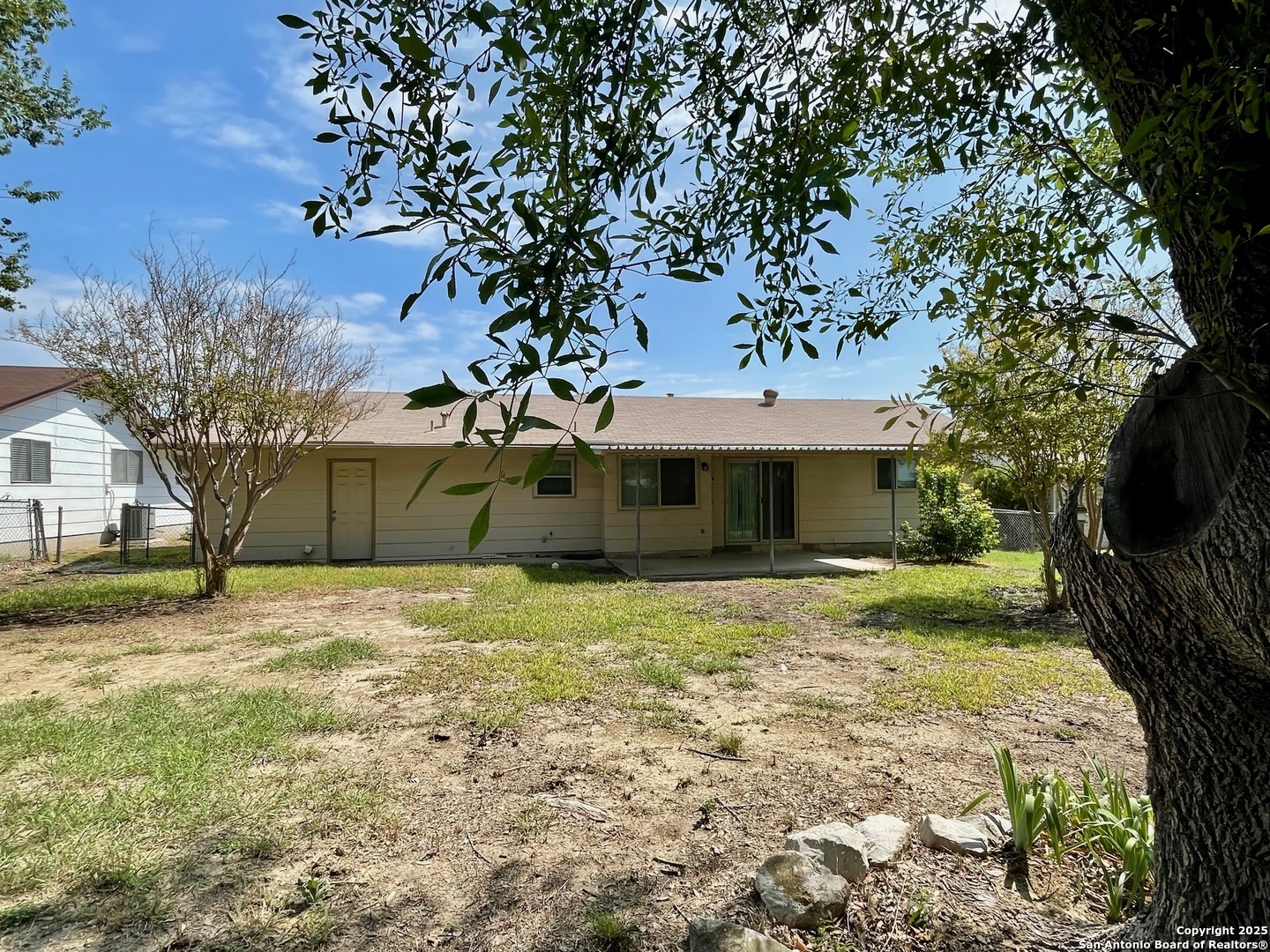 6714 Straw Flower Street Leon Valley, TX 78238 - Photo 23 of 23 a front view of a house with garden