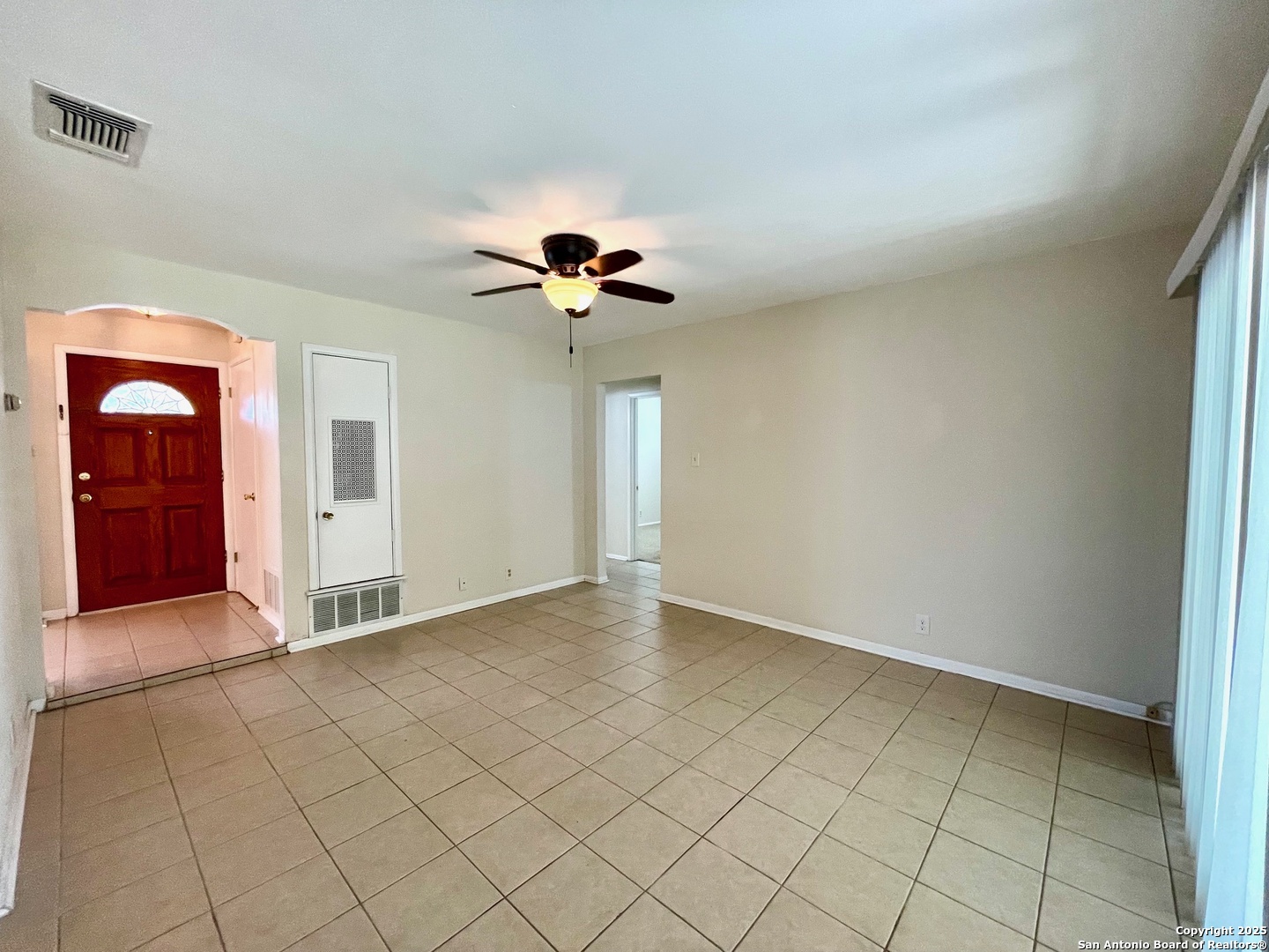 6714 Straw Flower Street Leon Valley, TX 78238 - Photo 6 of 23 an empty room with closet and chandelier fan