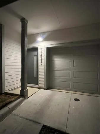 a view of an empty room and garage