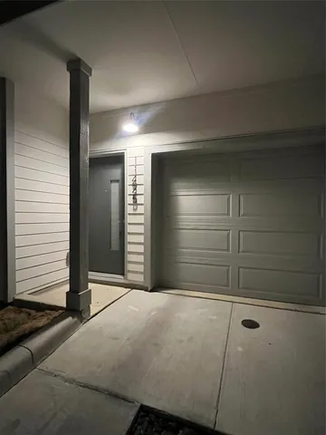 a view of an empty room and garage