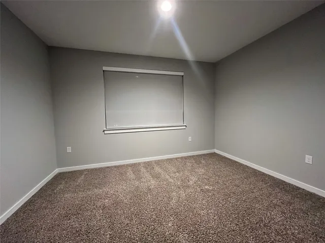an empty room with a empty space and window