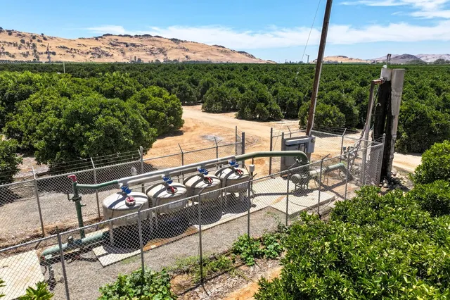 a view of a chairs and table in patio
