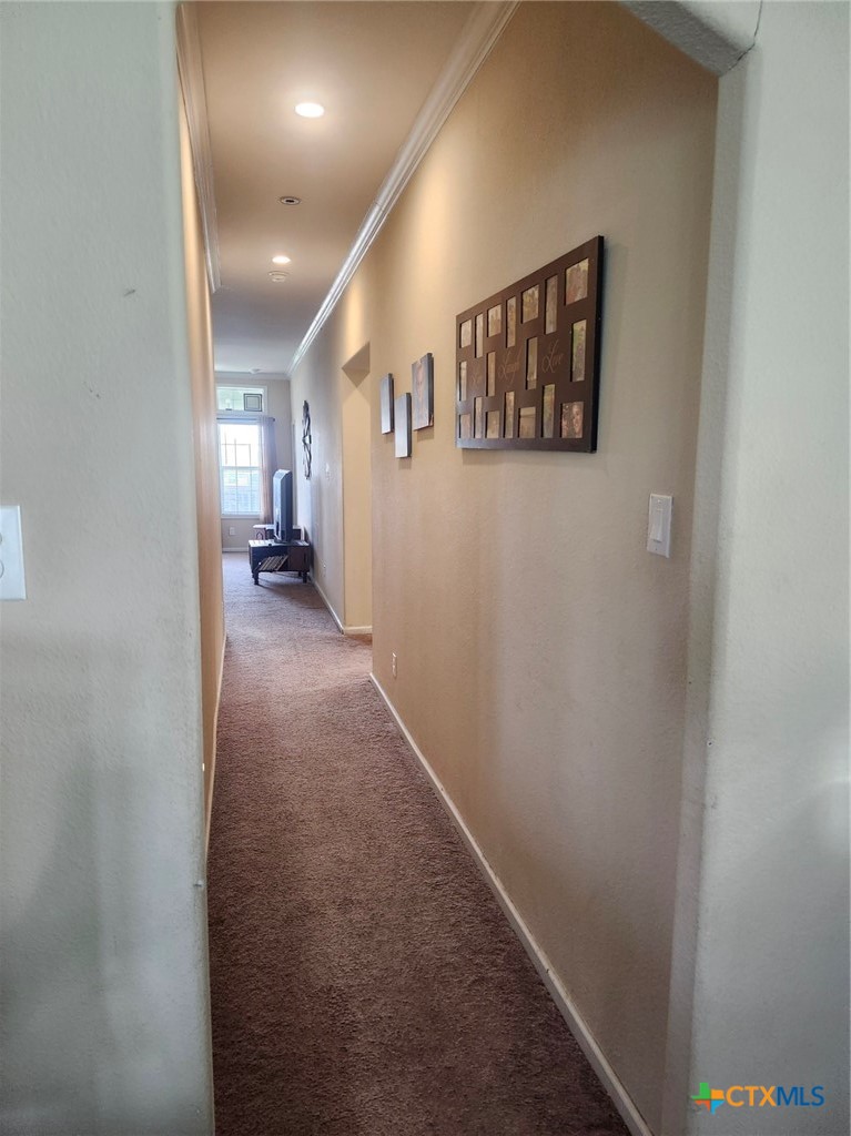 1845 Royal Road Port Lavaca, TX 77979 - Photo 7 of 22 a view of a hallway with paintings on the wall