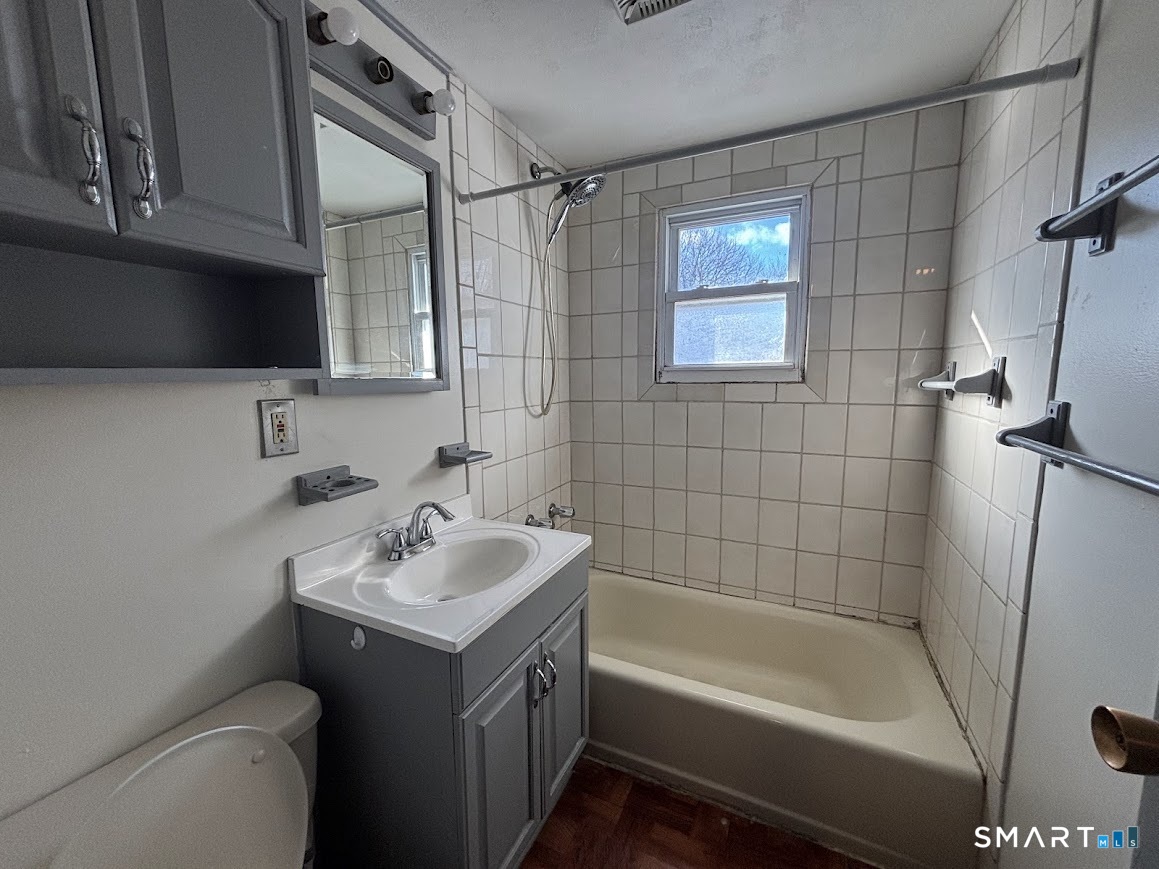 34 Seaver Circle Bridgeport, CT 06606 - Photo 15 of 18 a bathroom with a sink toilet and shower