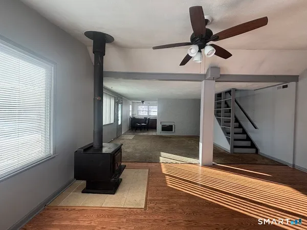a view of an entryway with wooden floor